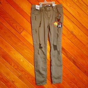1st Kiss size 11 green frayed skinny jeans with vintage traveler patches